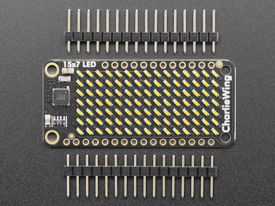 Video of a Adafruit 15x7 CharliePlex LED Matrix FeatherWing - waves of Warm White LED moving across the board. 