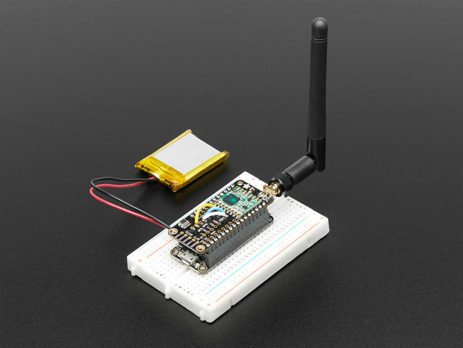 Angled shot of a Adafruit Radio FeatherWing - RFM69HCW 900MHz - RadioFruit. 