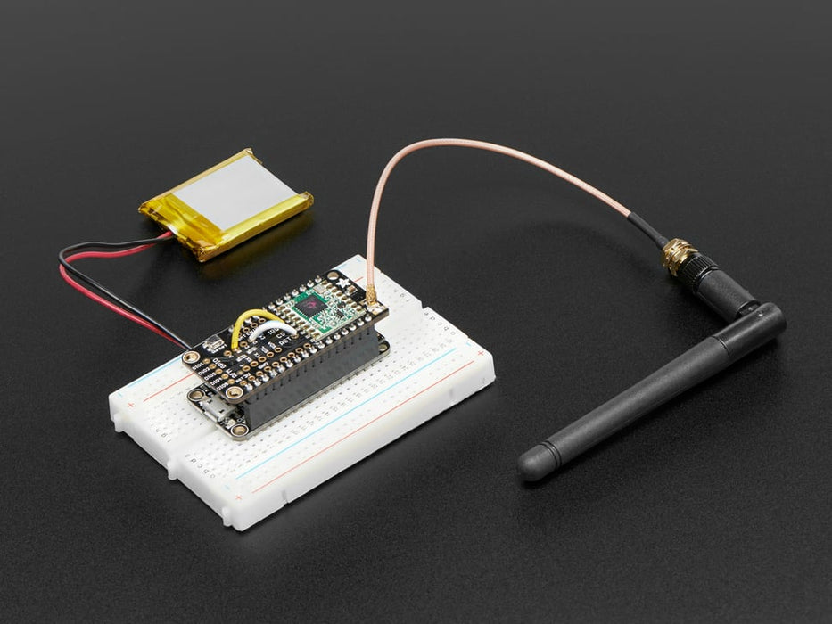 Angled shot of a Adafruit LoRa Radio FeatherWing - RFM95W 900 MHz - RadioFruit.