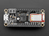 Angled shot of rectangular microcontroller with headers. 