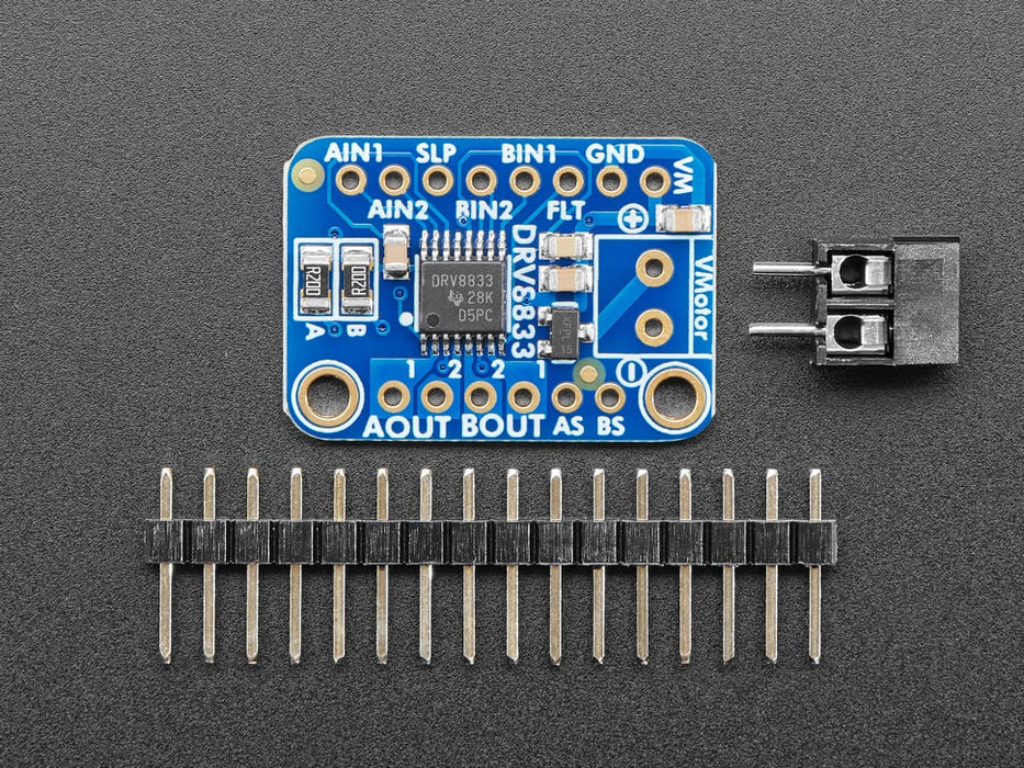 Video of a Adafruit DRV8833 DC/Stepper Motor Driver Breakout Board connected to a half sized white board powering a stepper motor with a adabot head spinning on it. 