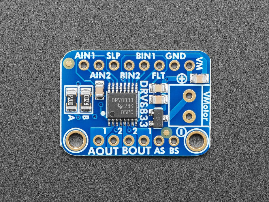 Video of a Adafruit DRV8833 DC/Stepper Motor Driver Breakout Board connected to a half sized white board powering a stepper motor with a adabot head spinning on it. 