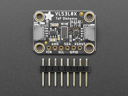 Video of a white hand hovering over a Adafruit VL53L0X Time of Flight Distance Sensor that's connected to a white breadboard reading the range of motion of the white hand. 