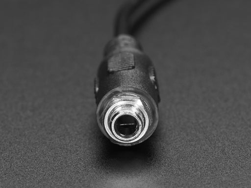 Angled shot of a Panel Mount Stereo Audio Extension Cable - 1/8" / 3.5mm. 