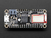 Angled shot of rectangular microcontroller with headers. 