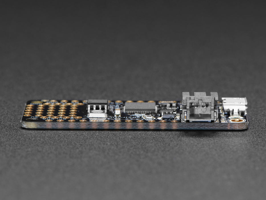 Angled shot of a Adafruit Feather M0 Express - ATSAMD21 Cortex M0. 