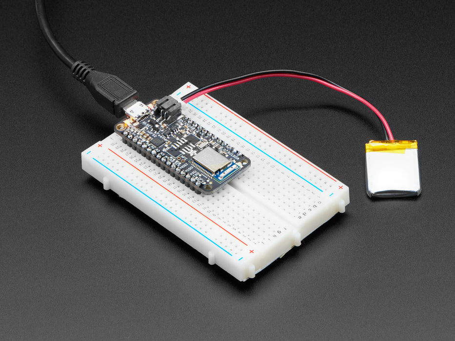 Video of an LED ring assembled on a half-size breadboard and microcontroller. A white hand changes the color of the LED ring by tapping colors on an app on a smart phone.