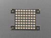 Hand holding small Adafruit DotStar High Density 8x8 Grid - 64 RGB LED Pixel Matrix