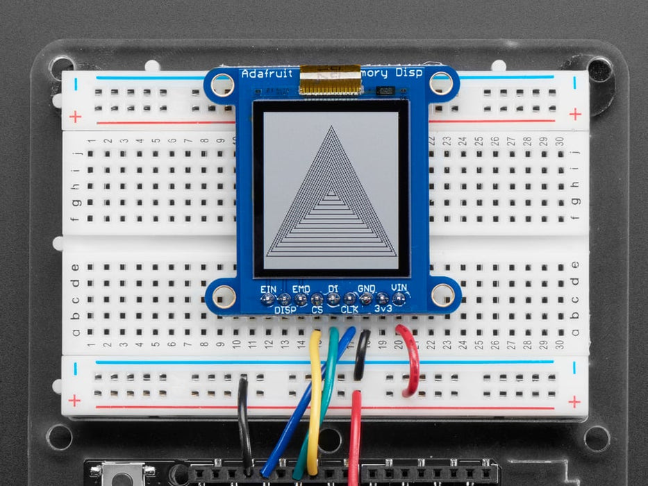 Top down view of a Adafruit SHARP Memory Display Breakout connected to a half-sized white breadboard. 