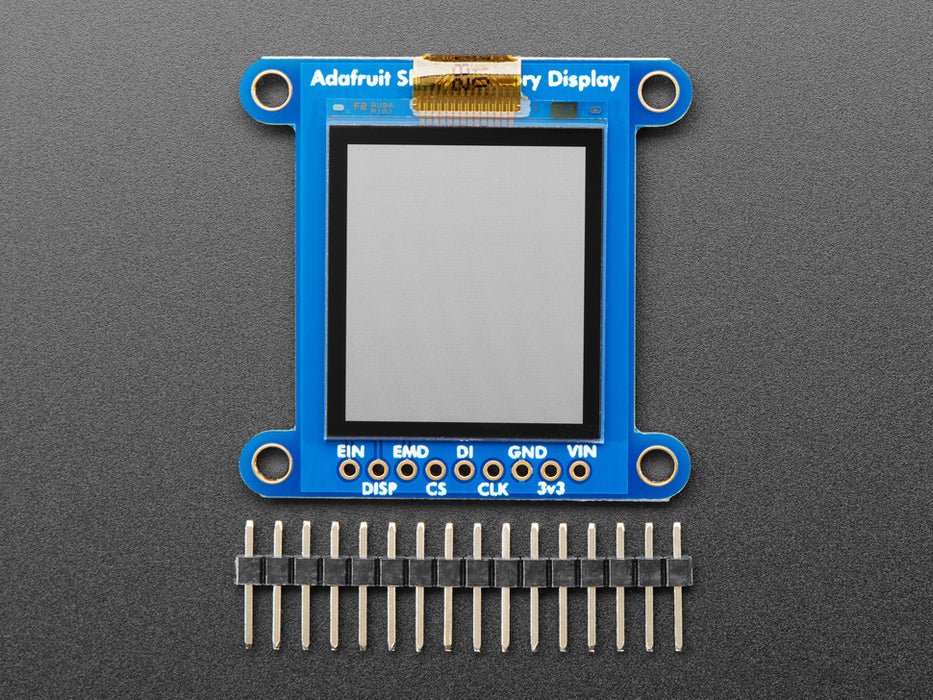 Top down view of a Adafruit SHARP Memory Display Breakout connected to a half-sized white breadboard. 