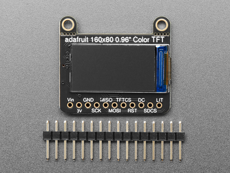 TFT breakout wired up on breadboard, showing colorful image