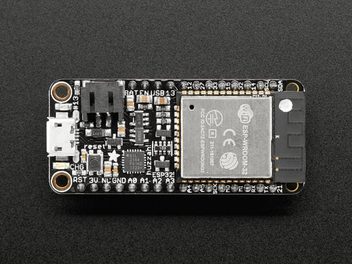 Angled shot of rectangular microcontroller with headers. 