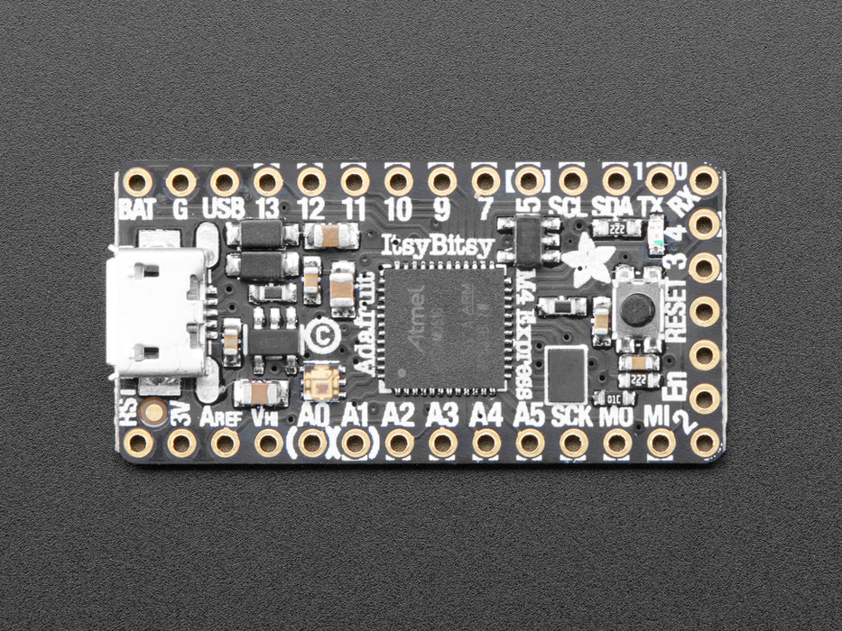 Adafruit ItsyBitsy M4 Express featuring ATSAMD51 connected to a small breadboard. 