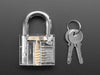 Hands holding clear padlock and opening with a small key.