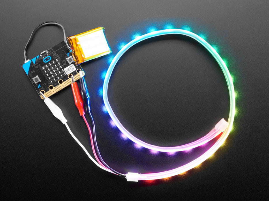 Adafruit NeoPixel LED 0.5 meter Strip with Alligator Clips wired to Circuit Playground, lighting up rainbow