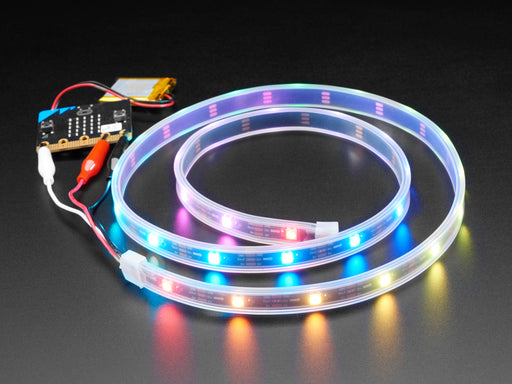 Adafruit NeoPixel LED 1 meter Strip with Alligator Clips wired to Circuit Playground, lighting up rainbow