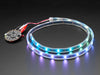 Adafruit NeoPixel LED 1 meter Strip with Alligator Clips wired to Circuit Playground, lighting up rainbow