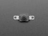 Angled shot of black mini on/off pushbutton switch with two mounting holes.
