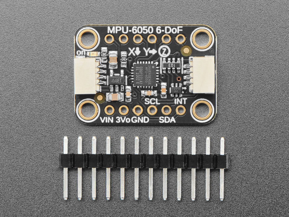 Video of a white hand moving a sensor around that connected to an OLED and white breadboard.