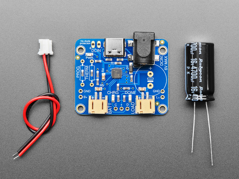 USB / DC / Solar Lithium Ion/Polymer charger connected to a lithium battery thought a 2-pin JST cable and the solar panel into the DC jack using a 2.1mm adapter cable.