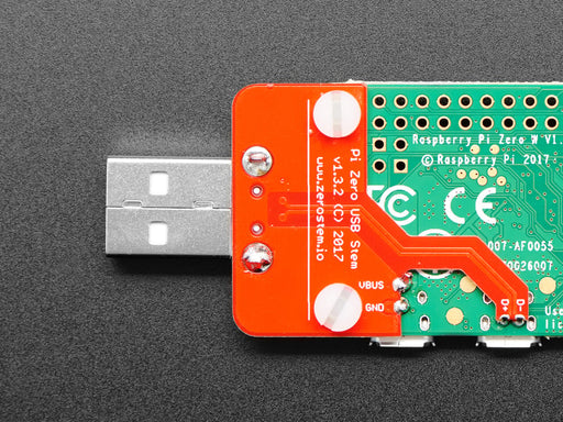 Angled shot of a Zero Stem for Pi Zero 1.3 and Pi Zero W 1.1 connected to Pi Zero and inserted into a macbook. 