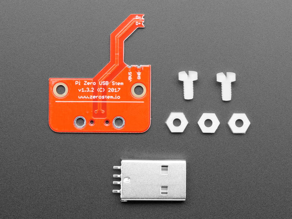 Angled shot of a Zero Stem for Pi Zero 1.3 and Pi Zero W 1.1 connected to Pi Zero and inserted into a macbook. 