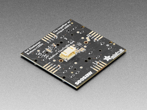 Hand pressing buttons that light up on a Adafruit NeoTrellis RGB Driver PCB for 4x4 Keypad.