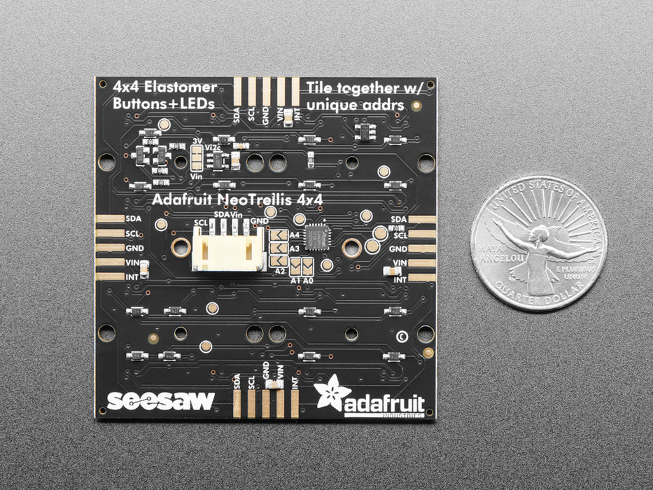 Hand pressing buttons that light up on a Adafruit NeoTrellis RGB Driver PCB for 4x4 Keypad.