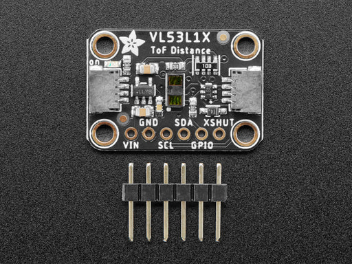 Top view of Adafruit VL53L1X Time of Flight Distance Sensor hooked up to an OLED display. A white manicured hand waves at the sensor, and the OLED displays the distance.