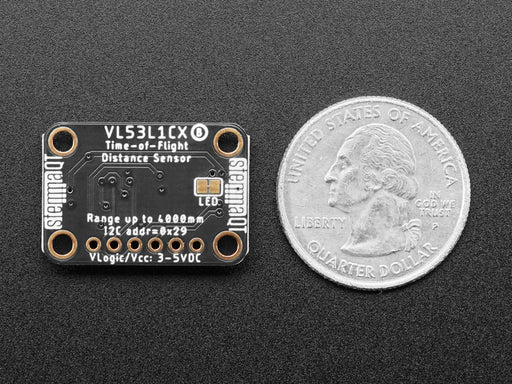 Top view of Adafruit VL53L1X Time of Flight Distance Sensor hooked up to an OLED display. A white manicured hand waves at the sensor, and the OLED displays the distance.