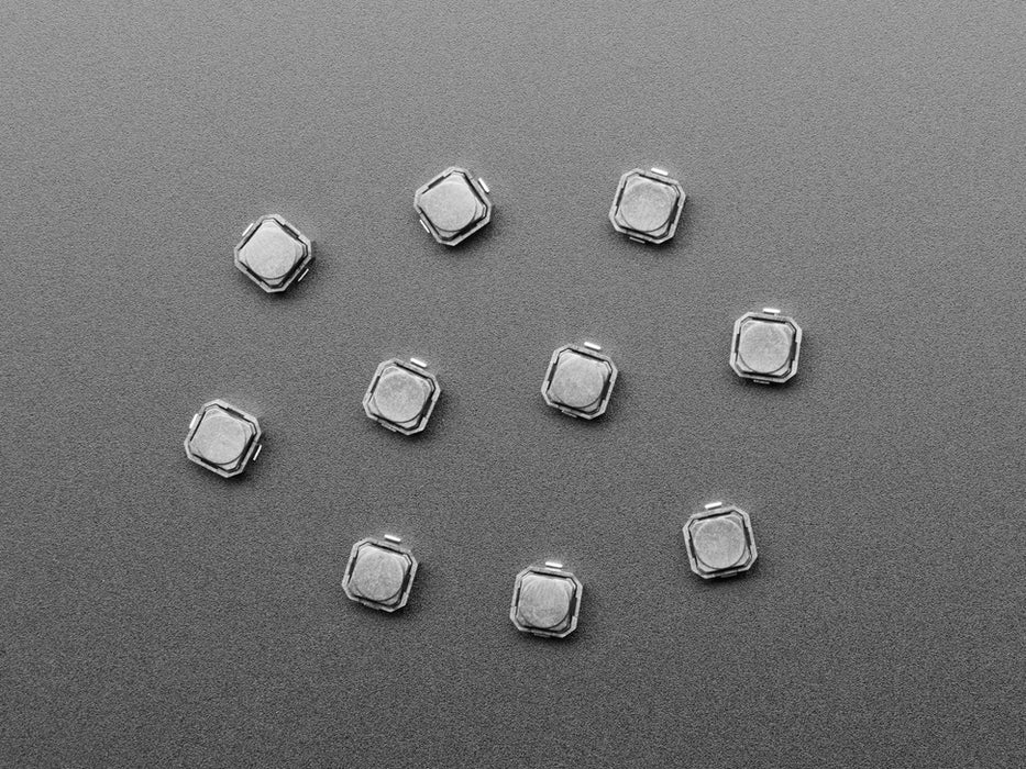 Angled shot of ten 6mm black mini soft touch pushbutton switches.