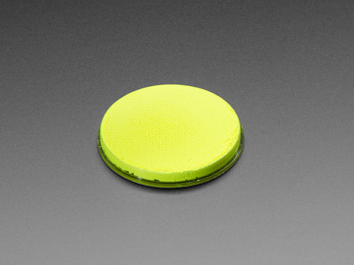 round yellow disc of fluorescent paint.