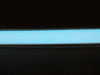 Coil of lit white Electroluminescent Tape Strip 