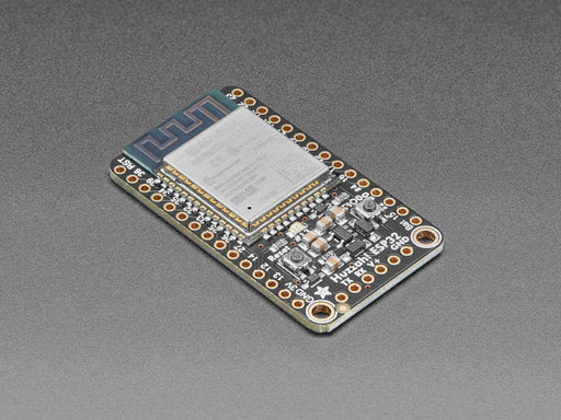 Angled shot of Adafruit HUZZAH32 – ESP32 Breakout Board. 