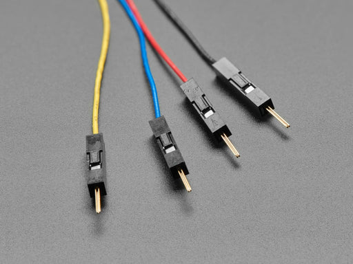 Top view of JST SH 4-pin to Premium Male Headers Cable next to US quarter for scale. 