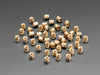 pile of 50 Brass Heat-Set Inserts for Plastic - M3 x 4mm.