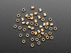 pile of 50 Brass Heat-Set Inserts for Plastic - M3 x 4mm.