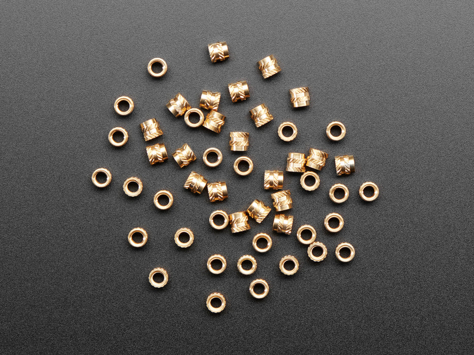 pile of 50 Brass Heat-Set Inserts for Plastic - M3 x 4mm.