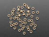 pile of 50 Brass Heat-Set Inserts for Plastic - M3 x 3mm.