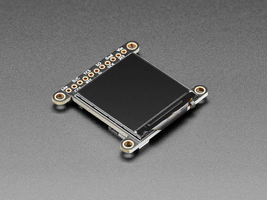 Overhead shot of 1.3" TFT breakout connected via EYESPI board and microcontroller on a half-size breadboard. The TFT breakout displays a colorful hexagon.