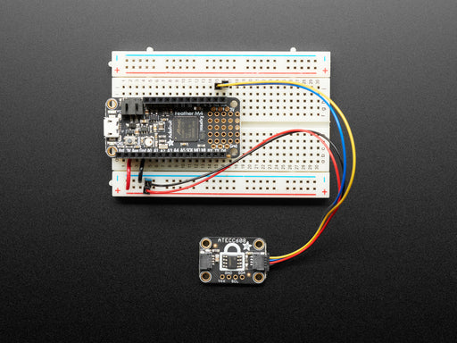 Adafruit ATECC608 Breakout Board  next to clear padlock