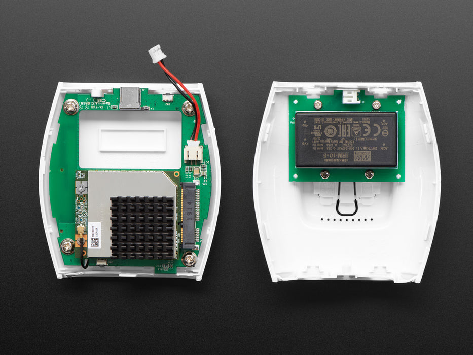 Front view of The Things Indoor LoRaWAN WiFi Gateway - 8 Channel LoRa 900 MHz plugged into a US wall socket. 