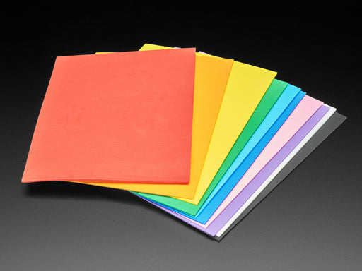 Angled shot of rainbow-colored EVA foam sheet packed fanned out.
