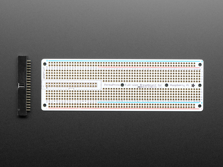 Angled shot of assembled Adafruit Perma-Proto 40-Pin Raspberry Pi Breadboard PCB with a Raspberry Pi 4.