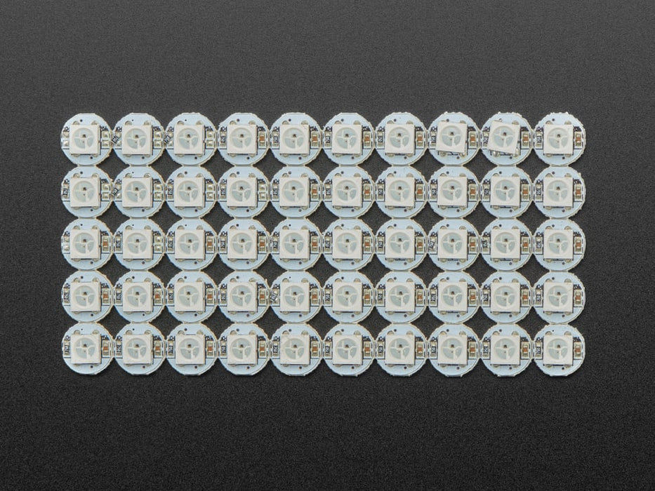 Glowing NeoPixel Mini Button PCB wired up to a microcontroller