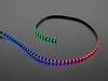 Curved NeoPixel LED strip wired to arduino, with each LED changing to a different color in the rainbow