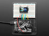 TFT breakout wired up on breadboard, showing colorful image of friendly owl