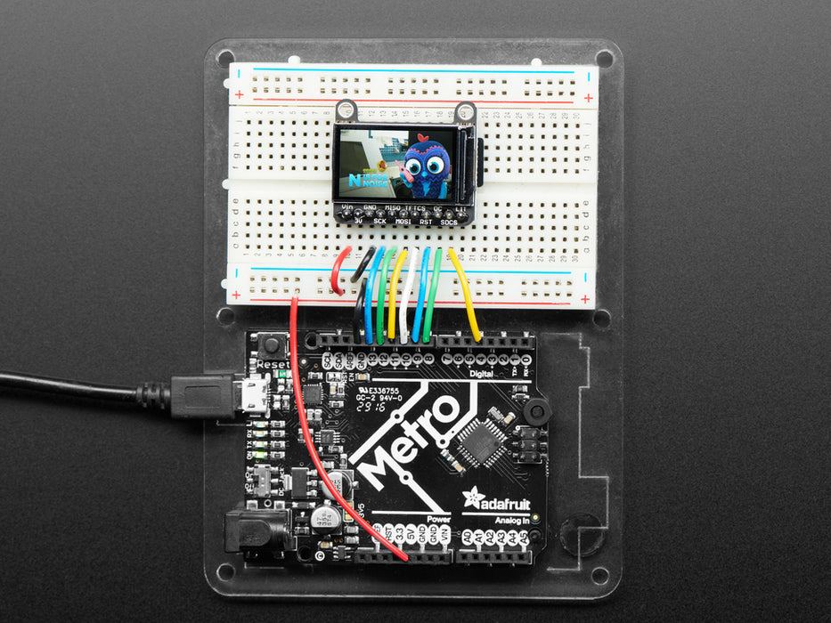 TFT breakout wired up on breadboard, showing colorful image of friendly owl