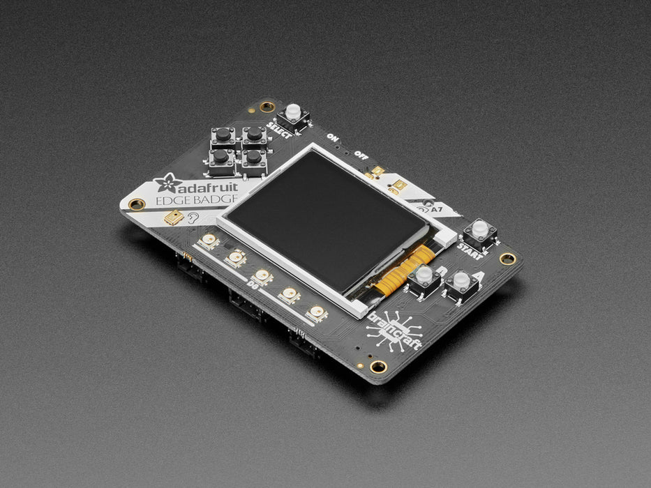 Top view of Adafruit EdgeBadge - Display reads "Test the TensorFlow lite voice model. Press and hold A button, say YES or NO, and see if the machine learned!".