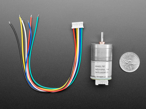 Angled view of a Geared DC Motor rotating while connected Circuitry shows RPM changing